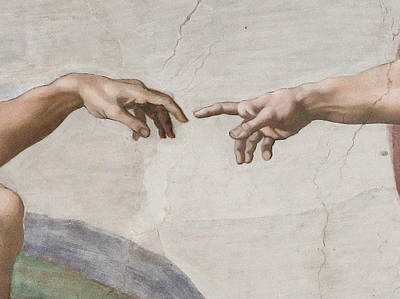 The reaching hands in Michelangelo’s The Creation of Adam.